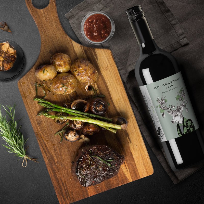 Red Deer Station red wine styled with roasted chicken and vegetables